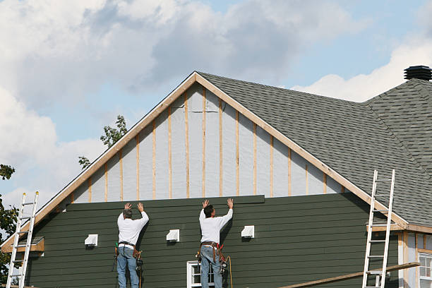 Professional Emergency Siding Repair technician working in Gambier, OH